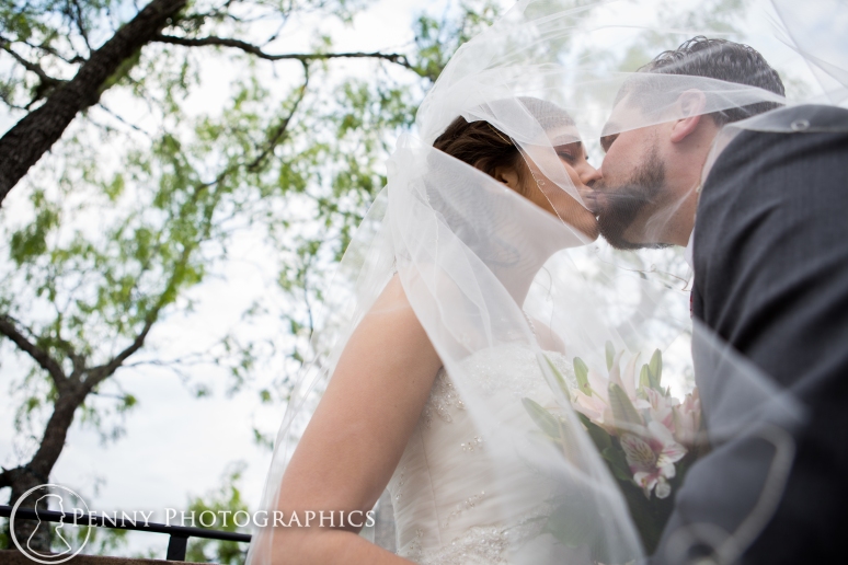 Romantic Wedding photo kiss under veil at TerrAdorna in Manor, TX