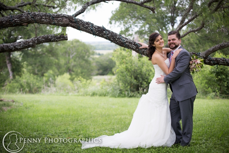 Wedding photos under tree at TerrAdorna in Manor, TX