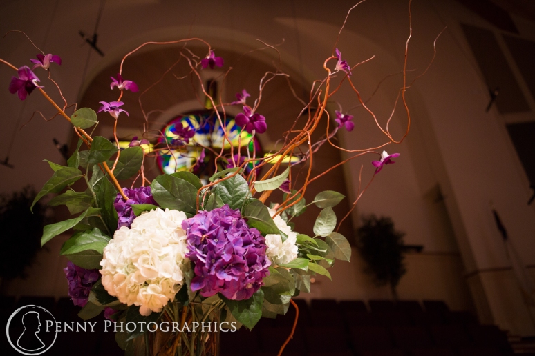 Purple flower arrangements church wedding