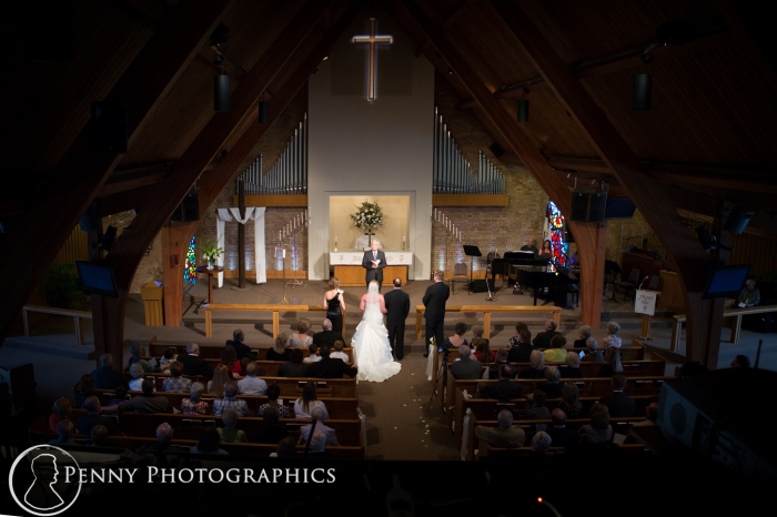 Bride and groom at the alter in Church wedding MN