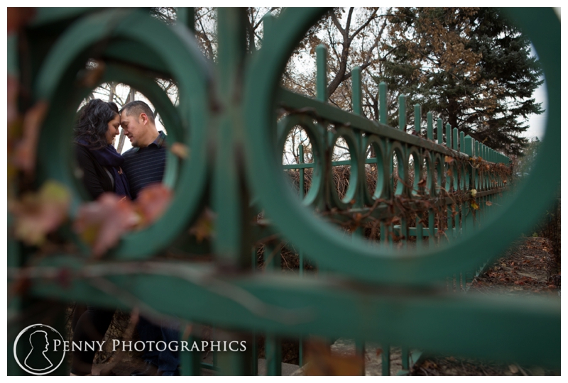 Outdoor Fall Engagement couple through the fence