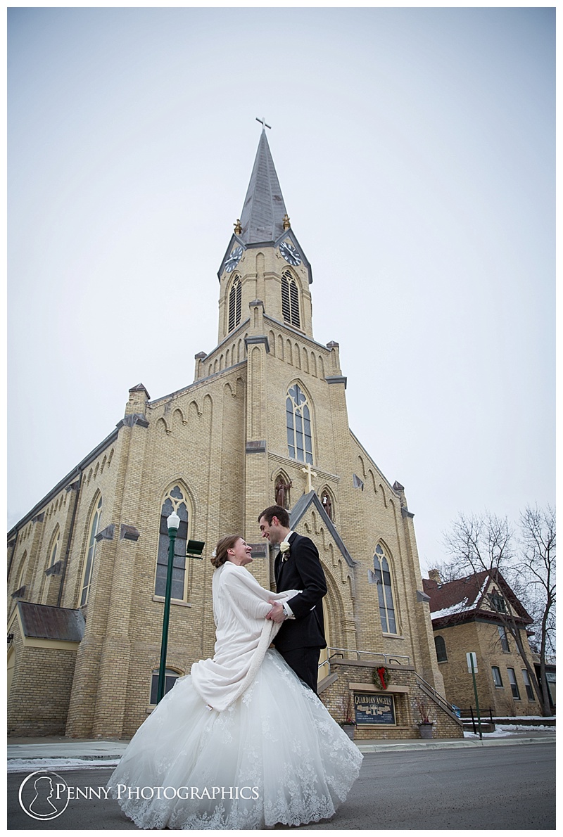 Minnesota Winter Wedding couple in front of church