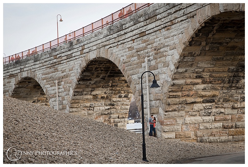 downtown engagement with dogs couple at stone arch bridge